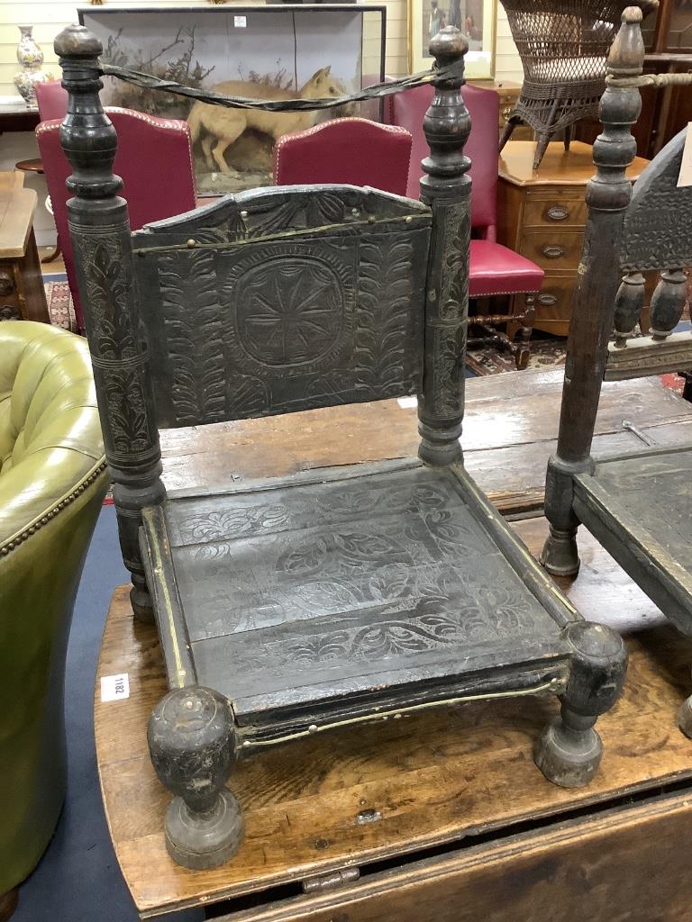 Two African carved hardwood seats, width 49cm, depth 39cm, height 64cm